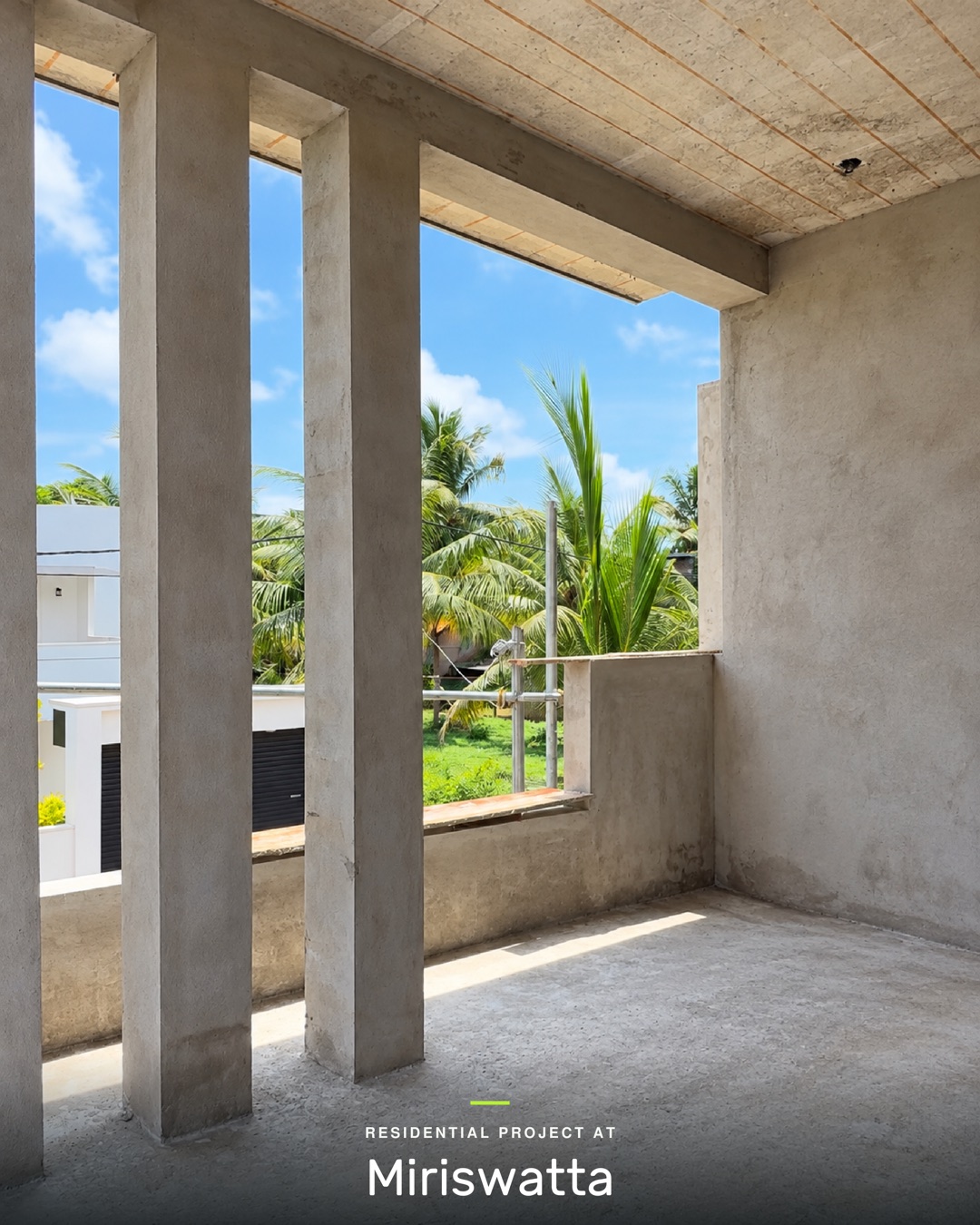 Balcony with tall plastered vertical fins framing the view